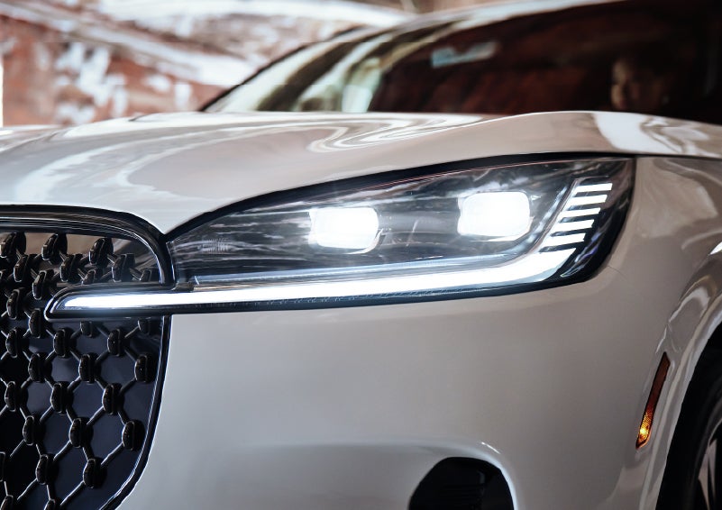 A close-up of a headlamp on the 2026 Lincoln Aviator® SUV is shown. | Lincoln North Miami in North Miami FL