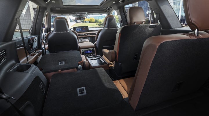 One side of the PowerFold® third-row seat and a second-row seat are folded forward in the 2026 Lincoln Aviator® SUV. | Lincoln North Miami in North Miami FL