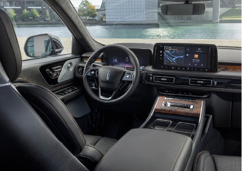 The interior of the 2026 Lincoln Aviator® SUV is shown parked with a view of a harbor through the windshield. | Lincoln North Miami in North Miami FL