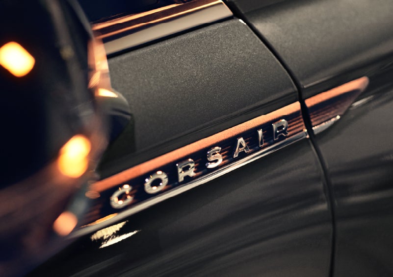A 2026 Lincoln Corsair® SUV is shown being driven on a country road. | Lincoln North Miami in North Miami FL