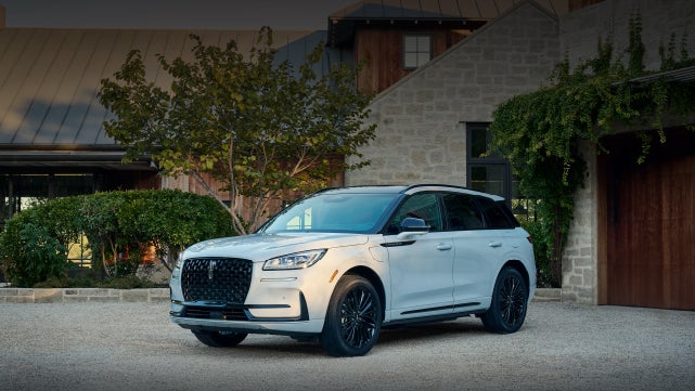 A 2026 Lincoln Corsair® SUV is parked in front off a luxury home. | Lincoln North Miami in North Miami FL
