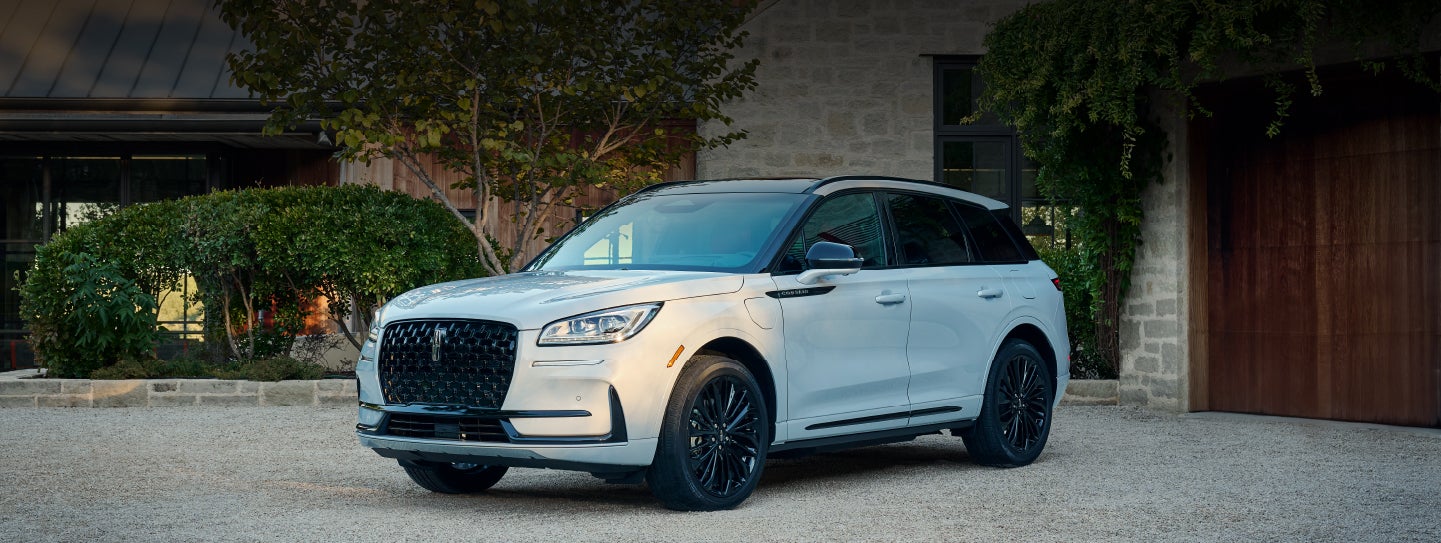 A 2026 Lincoln Corsair® SUV is parked in front off a luxury home. | Lincoln North Miami in North Miami FL
