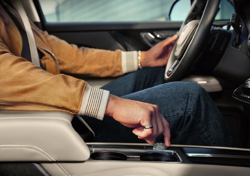 The driver of a 2026 Lincoln Corsair® SUV is shown selecting a drive mode. | Lincoln North Miami in North Miami FL