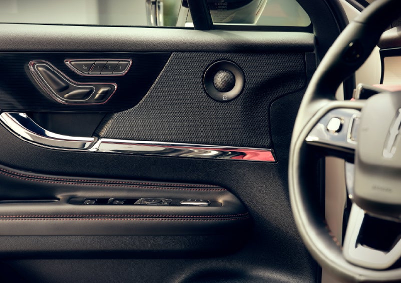 An audio speaker is shown in the driver's side door of a 2026 Lincoln Corsair® SUV | Lincoln North Miami in North Miami FL