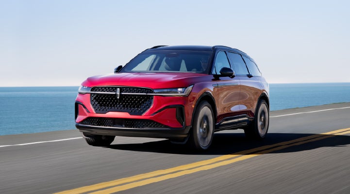 A 2026 Lincoln Nautilus® SUV is being driven on a seaside roadway. | Lincoln North Miami in North Miami FL