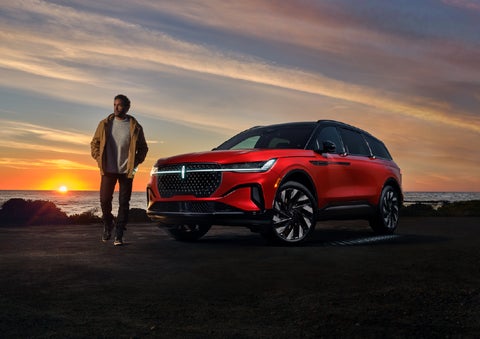 A person is shown next to a 2026 Lincoln Nautilus® SUV as the Lincoln Embrace sequence takes place. | Lincoln North Miami in North Miami FL