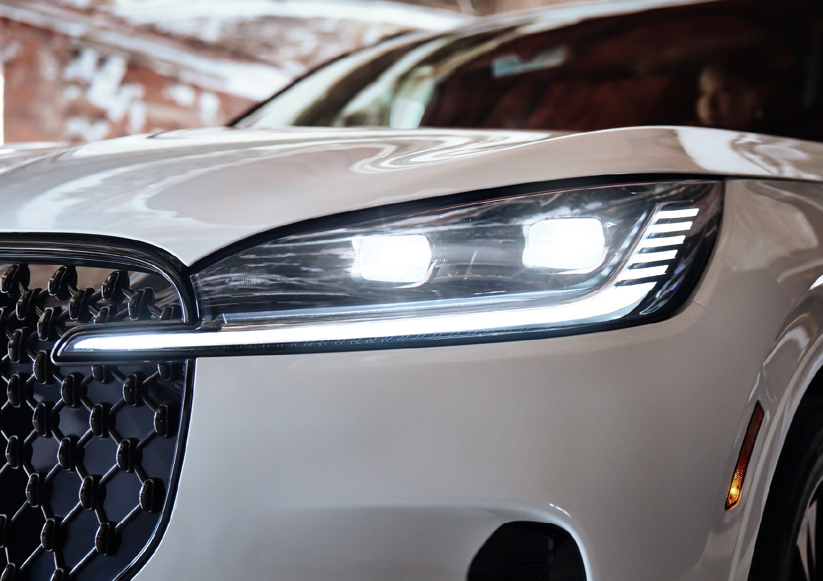 A close-up of a headlamp on the 2027 Lincoln Aviator® SUV is shown. | Lincoln North Miami in North Miami FL