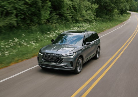 A 2027 Lincoln Aviator® SUV is being driven down a road. | Lincoln North Miami in North Miami FL