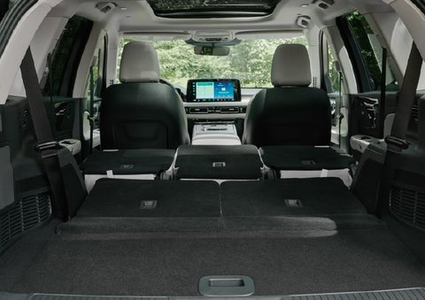 A rear to front view of the interior of a 2027 Lincoln Aviator® Black Label™ SUV shows the third and second rows folded flat | Lincoln North Miami in North Miami FL